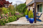 The front entrance of a house with a circular garden bed