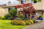 The front entrance of a house with a circular garden bed